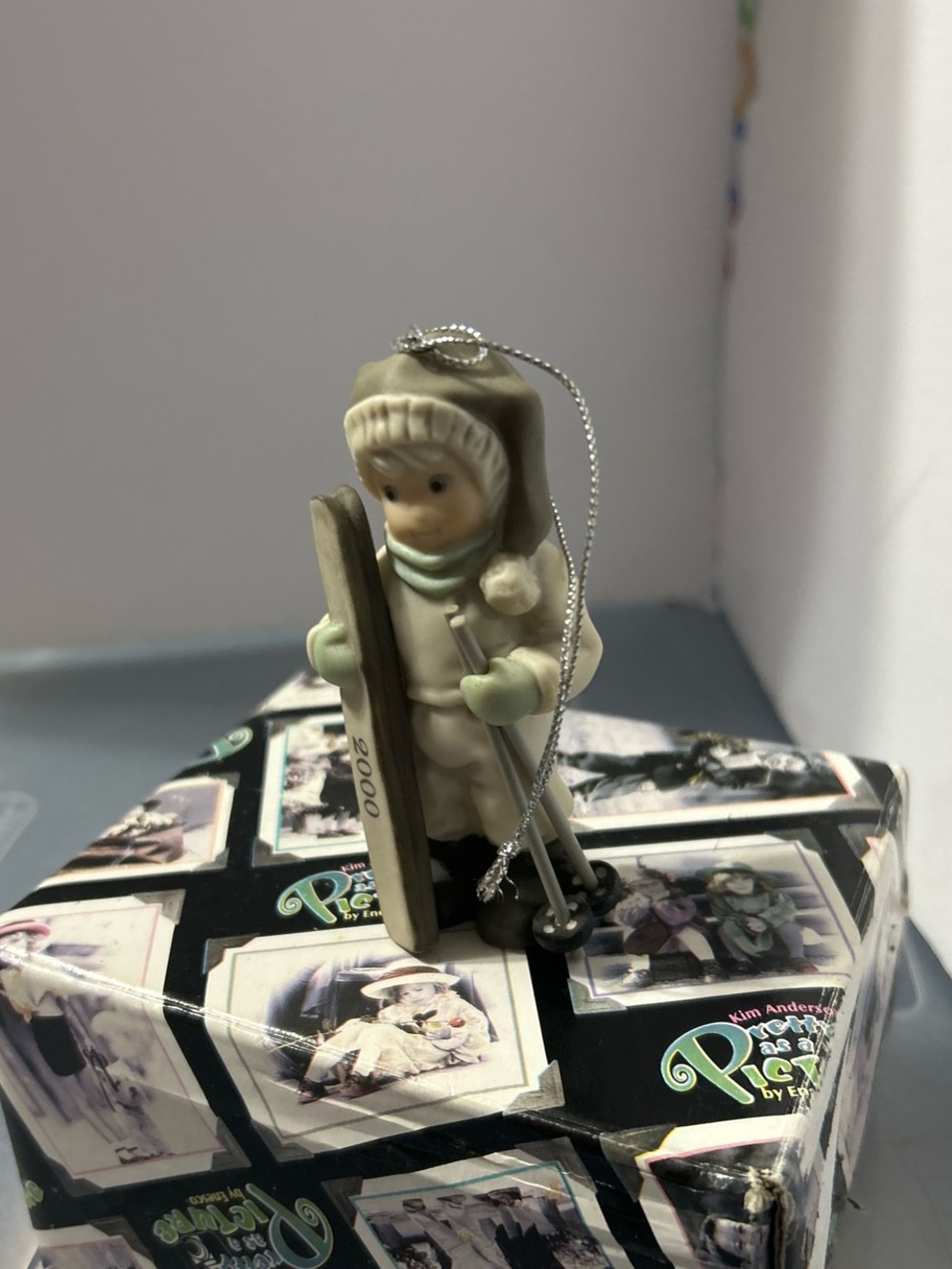 Enesco Porcelain Skiing Ornament in Cream and Sage